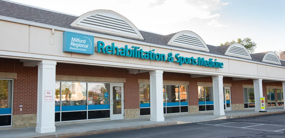 The "Rehabilitation and Sports Medicine" sign on the exterior of the building.