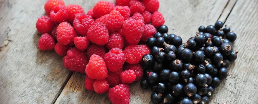 raspberries and blueberries shaped in hearts
